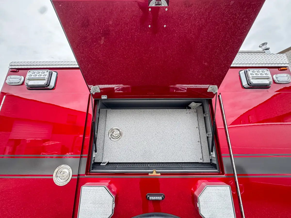 Rear side compartment open angle showing interior walls and shelf track.